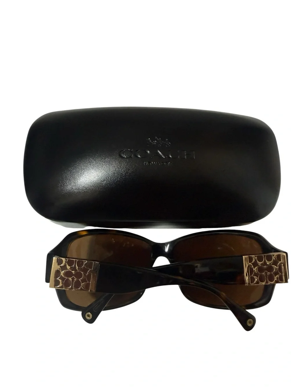Coach Nina S494Tortoise Sunglasses featuring a dark brown tortoiseshell frame